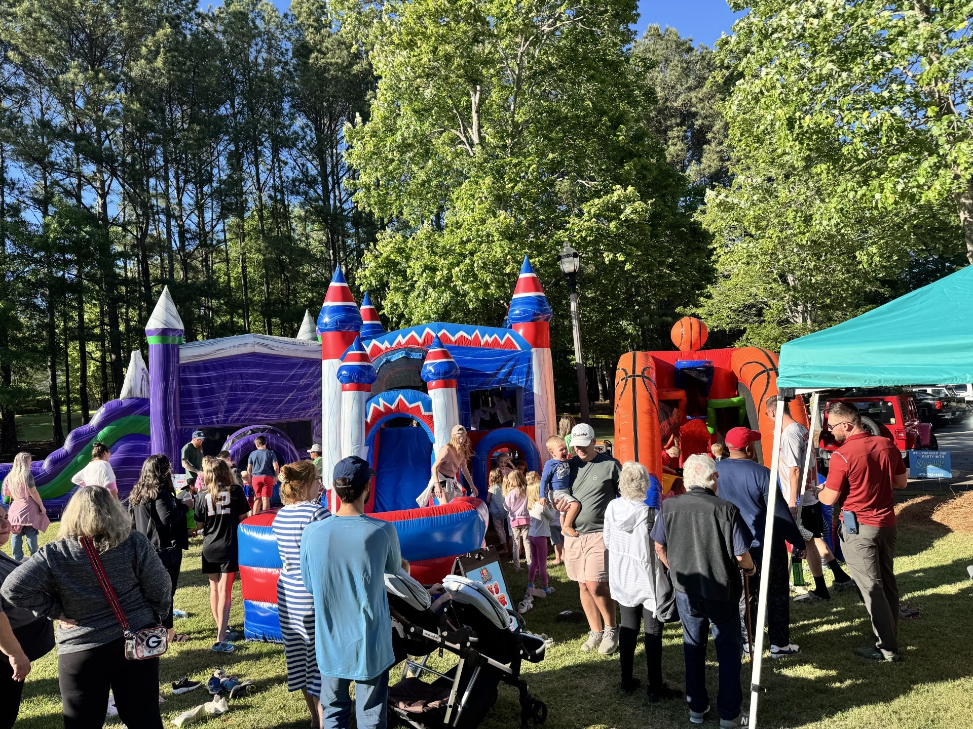 How We Clean Our Bounce Houses | Shindigz Event Rentals Newnan, GA 1 Kids bouncing in a Shindigz Event Rentals bounce house at a backyard birthday party in Newnan, GA